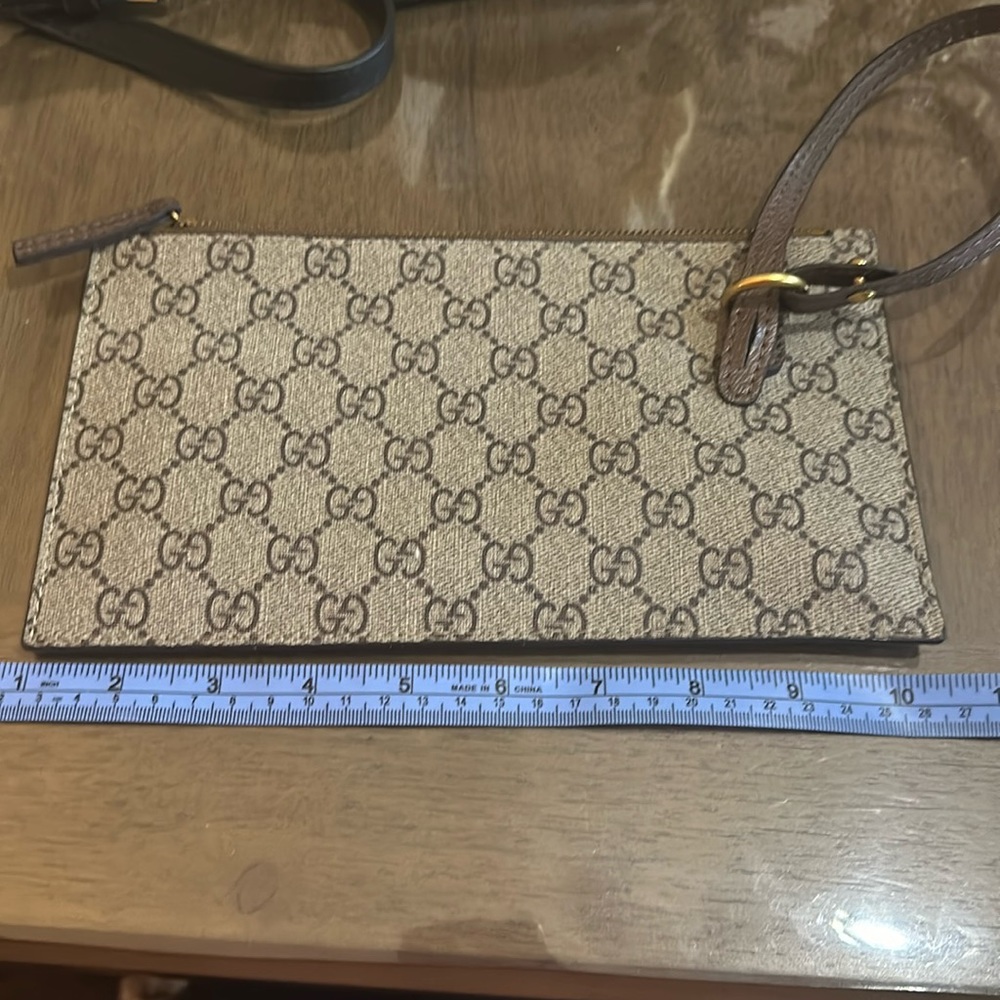 Brown and tan like clutch with gold metal